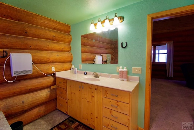 bathroom featuring vanity and log walls