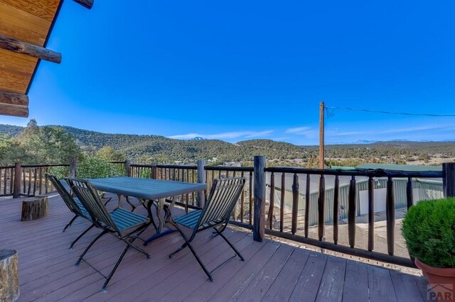 wooden terrace featuring a mountain view