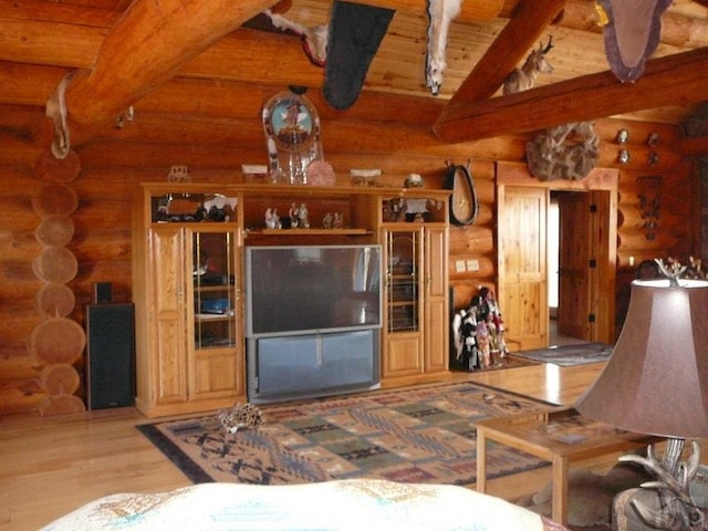 living room featuring vaulted ceiling with beams, wood ceiling, and wood finished floors