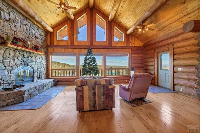 living room with ceiling fan, high vaulted ceiling, wooden ceiling, and light wood-style floors