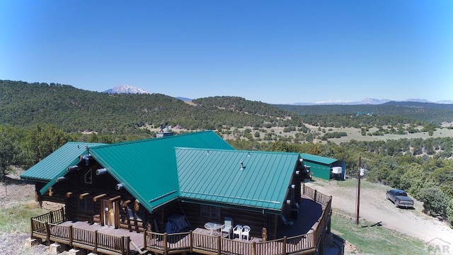 bird's eye view with a view of trees and a mountain view