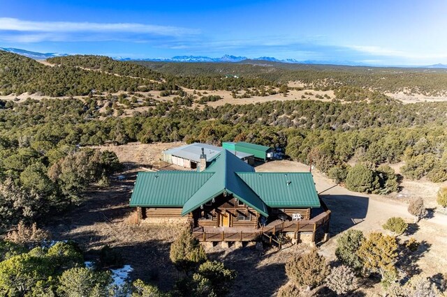 bird's eye view with a mountain view and a view of trees