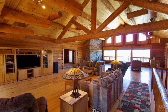 living room featuring rustic walls, wood ceiling, high vaulted ceiling, and light wood-style floors