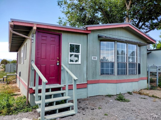 exterior space with entry steps and fence