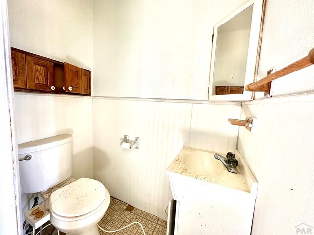 bathroom with toilet and vanity