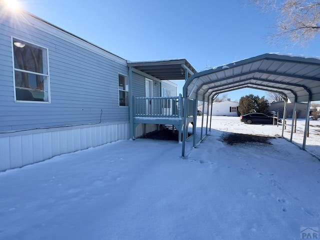 exterior space featuring a detached carport and a deck