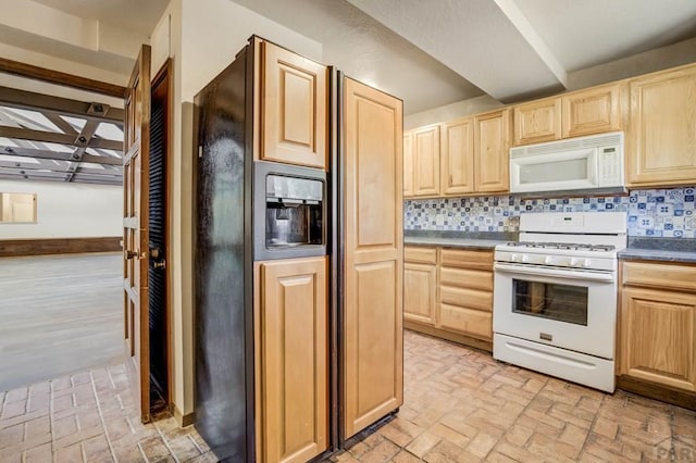 kitchen featuring light brown cabinetry, white appliances, brick floor, and backsplash