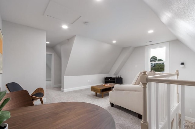 interior space featuring lofted ceiling, recessed lighting, light carpet, an upstairs landing, and baseboards