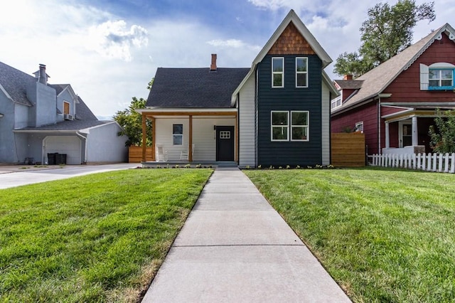 view of front of home with fence and a front yard