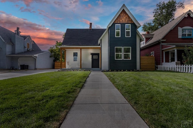 view of front of house featuring a front yard and fence