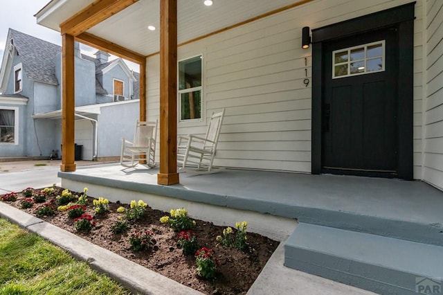 property entrance with covered porch