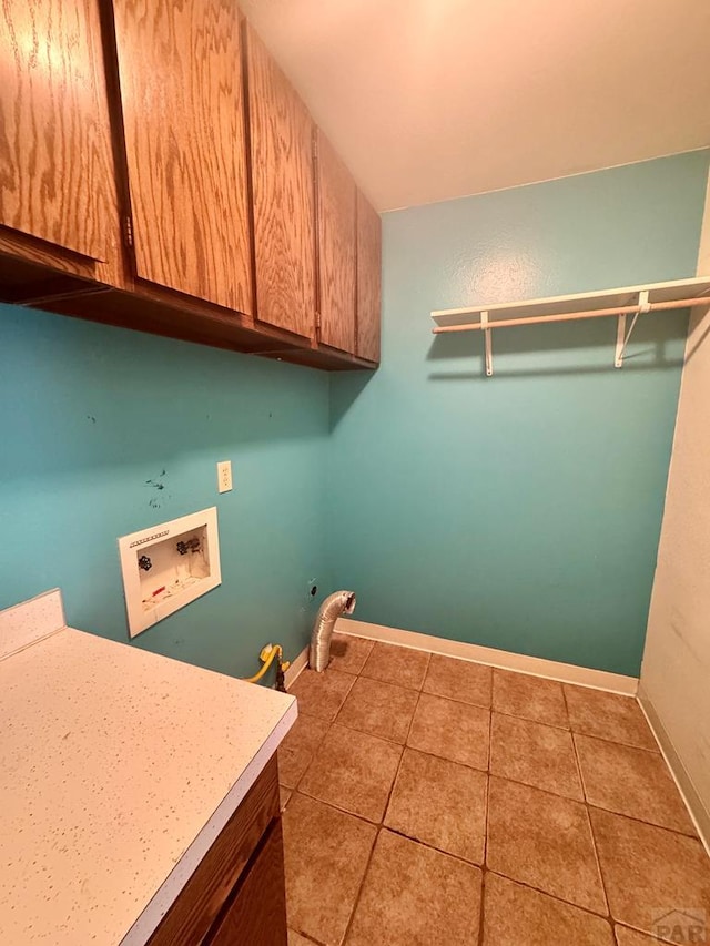 19 Cornell Cir, Pueblo, CO 81005 - washroom with cabinet space, washer hookup, tile patterned floors, and gas dryer hookup