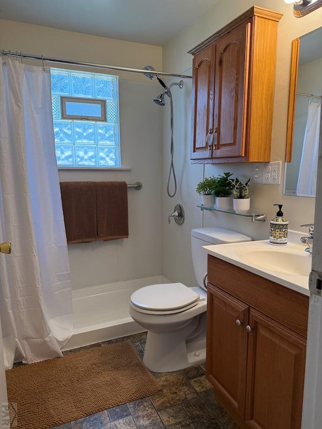 402 Alma Ave, Pueblo, CO 81004 - full bathroom with vanity, a shower with curtain, and stone finish flooring