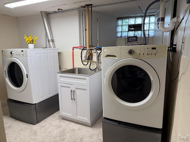 402 Alma Ave, Pueblo, CO 81004 - washroom with separate washer and dryer, light colored carpet, and cabinet space
