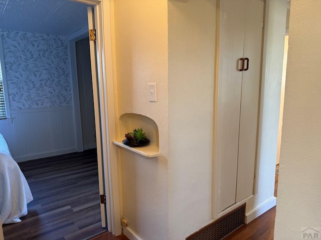 402 Alma Ave, Pueblo, CO 81004 - hallway with wood finished floors, wainscoting, and wallpapered walls