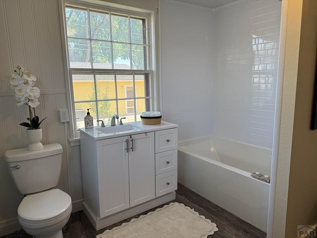 402 Alma Ave, Pueblo, CO 81004 - bathroom with vanity, wood finished floors, and shower / bathtub combination