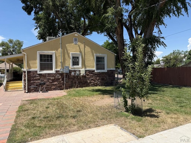 402 Alma Ave, Pueblo, CO 81004 - view of front facade featuring stone siding and stucco siding