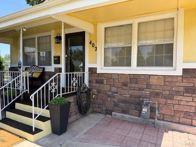 402 Alma Ave, Pueblo, CO 81004 - entrance to property with covered porch and stucco siding