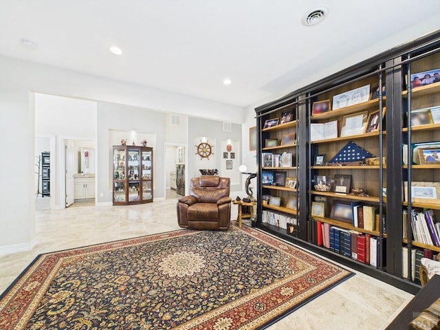 sitting room featuring baseboards, visible vents, and recessed lighting