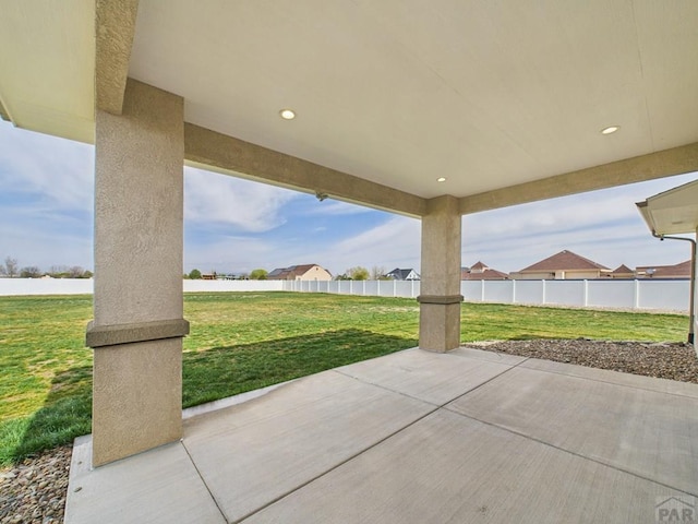 view of patio featuring fence