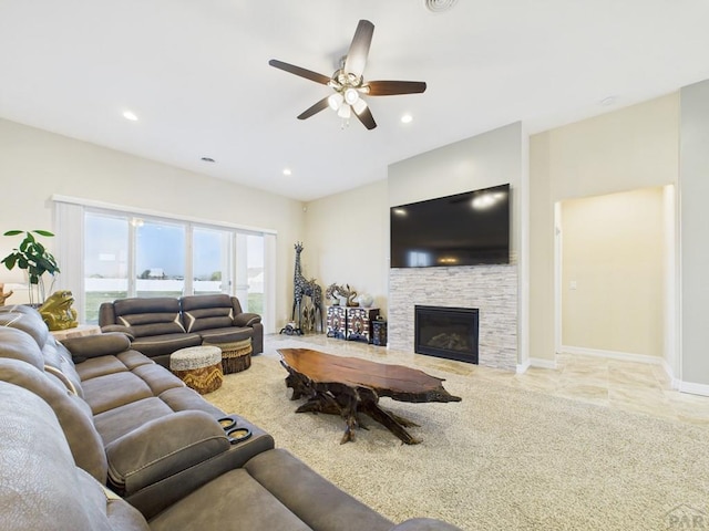 living area with baseboards, ceiling fan, recessed lighting, and a fireplace