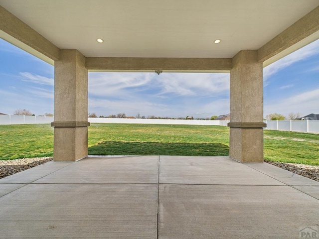 view of patio featuring fence