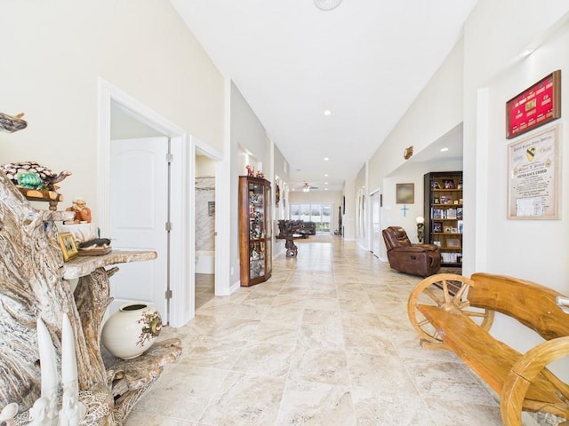 hall featuring recessed lighting