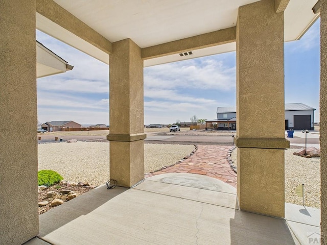 view of patio featuring visible vents