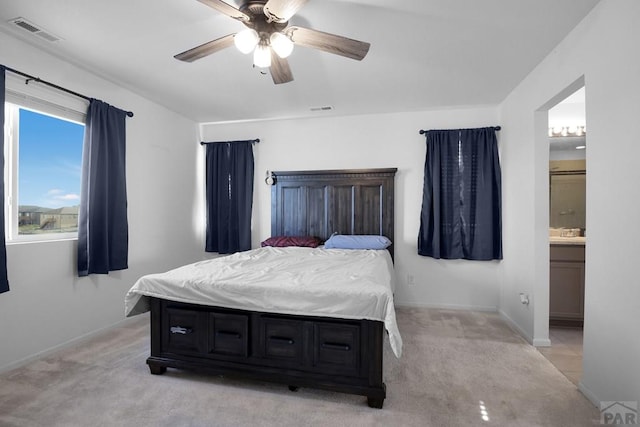 bedroom with light carpet, visible vents, and a ceiling fan