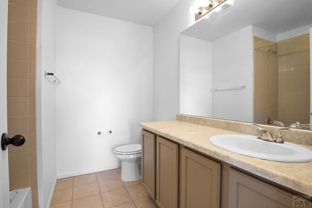 bathroom with washtub / shower combination, vanity, tile patterned flooring, and toilet