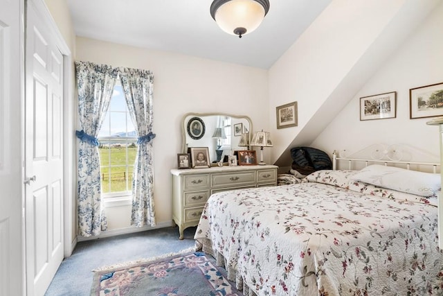 bedroom with carpet and baseboards