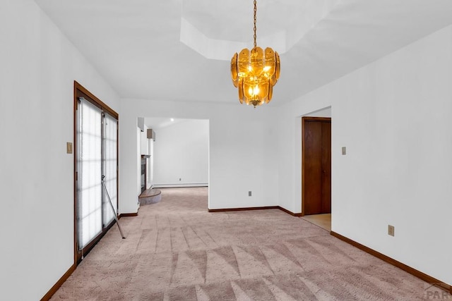 empty room with light carpet, baseboards, a fireplace with raised hearth, baseboard heating, and a chandelier