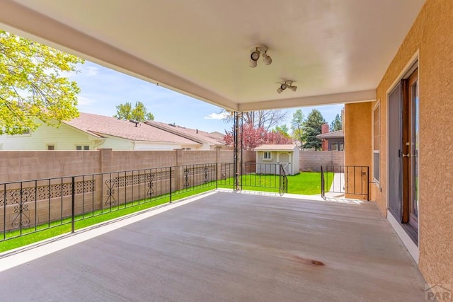 view of patio / terrace featuring a fenced backyard and a residential view