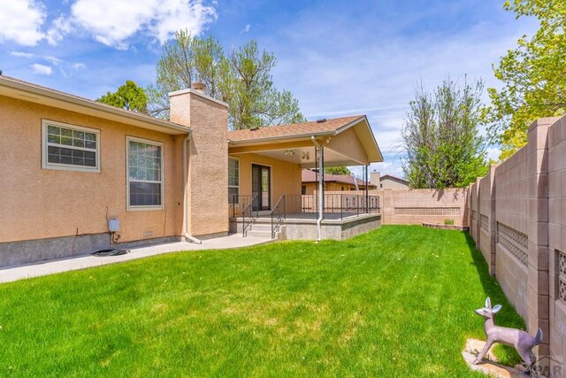 exterior space with a patio area and a fenced backyard