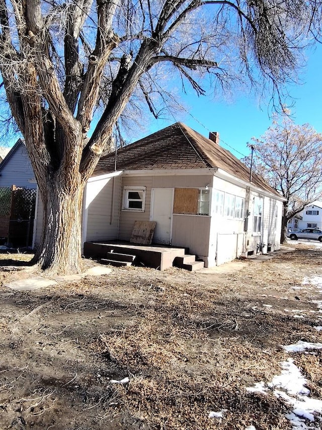 1623 Pine St, Pueblo, CO 81004 - view of home's exterior featuring a shingled roof