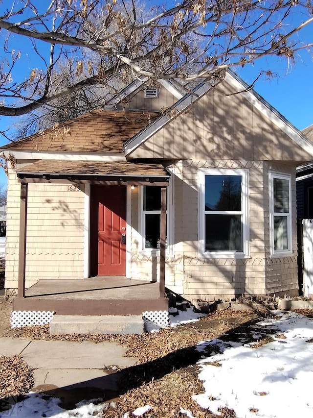 1623 Pine St, Pueblo, CO 81004 - snow covered property entrance featuring brick siding