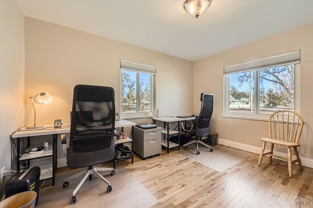 office area featuring hardwood / wood-style flooring and baseboards