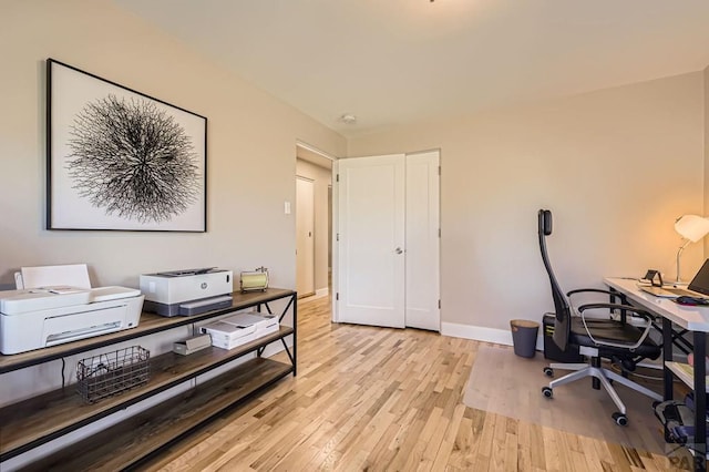 office featuring light wood finished floors and baseboards