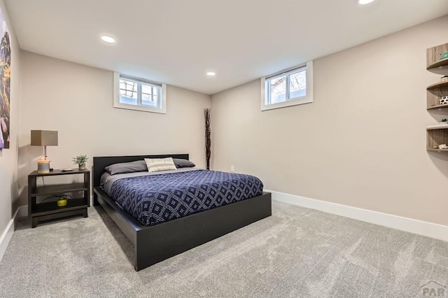 carpeted bedroom featuring baseboards and recessed lighting