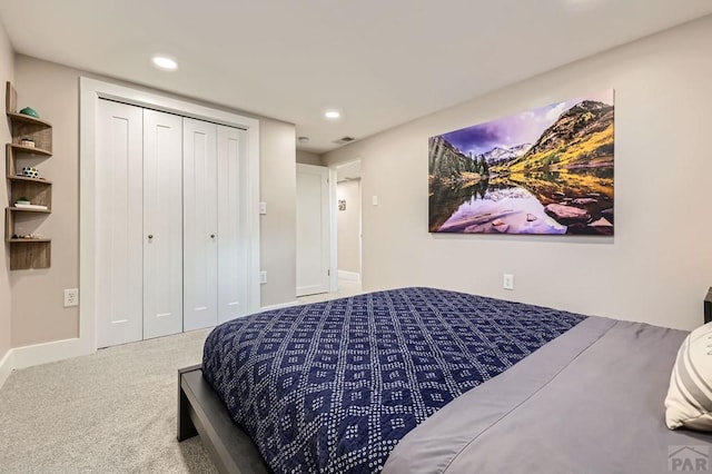 bedroom with recessed lighting, visible vents, baseboards, a closet, and carpet