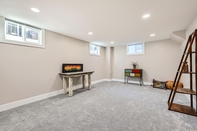 below grade area with baseboards, carpet flooring, and recessed lighting