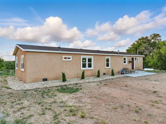 52825 E US Highway 50, Boone, CO 81025 - back of property featuring a patio, stucco siding, and crawl space