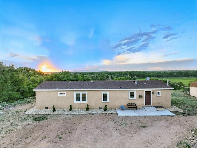 52825 E US Highway 50, Boone, CO 81025 - back of property at dusk featuring a patio and stucco siding