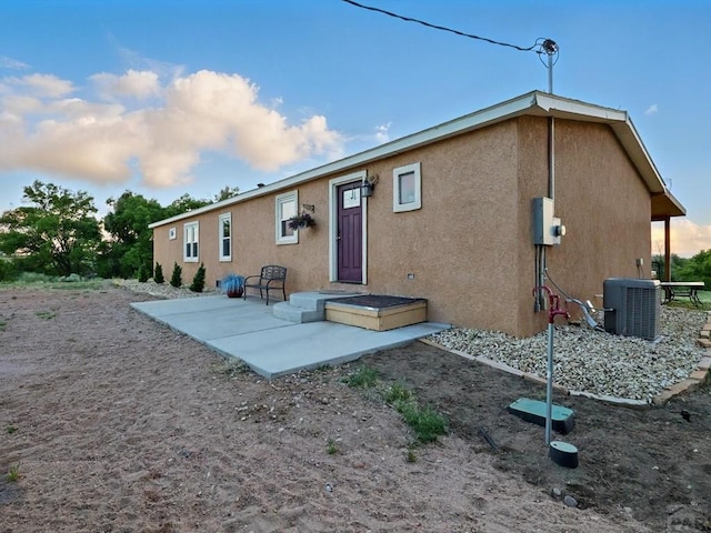 52825 E US Highway 50, Boone, CO 81025 - rear view of house featuring stucco siding and a patio area