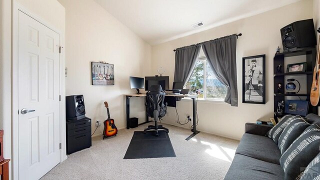 office area with light carpet, visible vents, and lofted ceiling