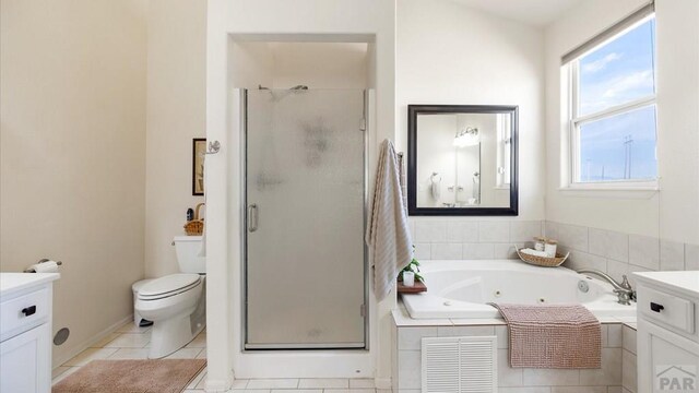 full bath with a stall shower, visible vents, a jetted tub, tile patterned flooring, and vanity