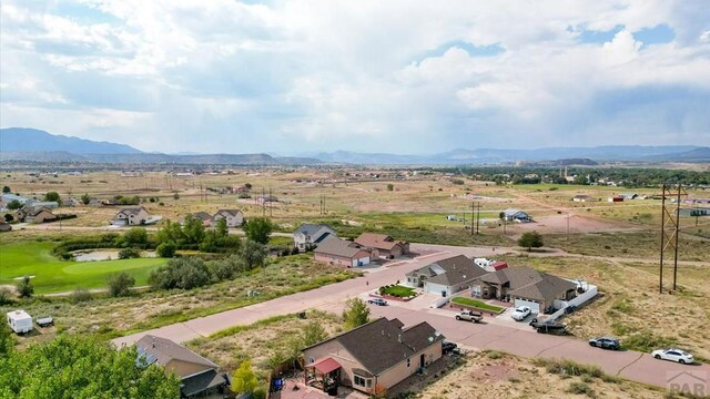 bird's eye view with a residential view and a mountain view