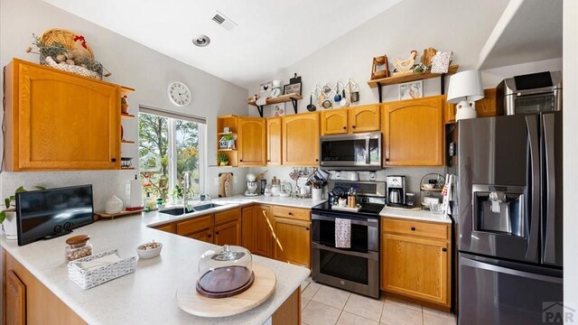 kitchen with open shelves, light countertops, visible vents, appliances with stainless steel finishes, and a sink