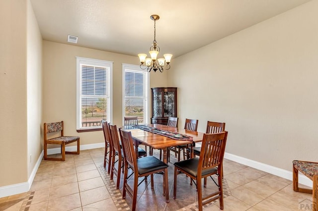 611 Rock Ridge Loop, Canon City, CO 81212 - dining space with a chandelier, baseboards, and light tile patterned floors