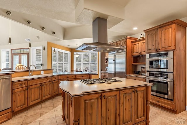 611 Rock Ridge Loop, Canon City, CO 81212 - kitchen featuring stainless steel appliances, island exhaust hood, a sink, brown cabinets, and recessed lighting